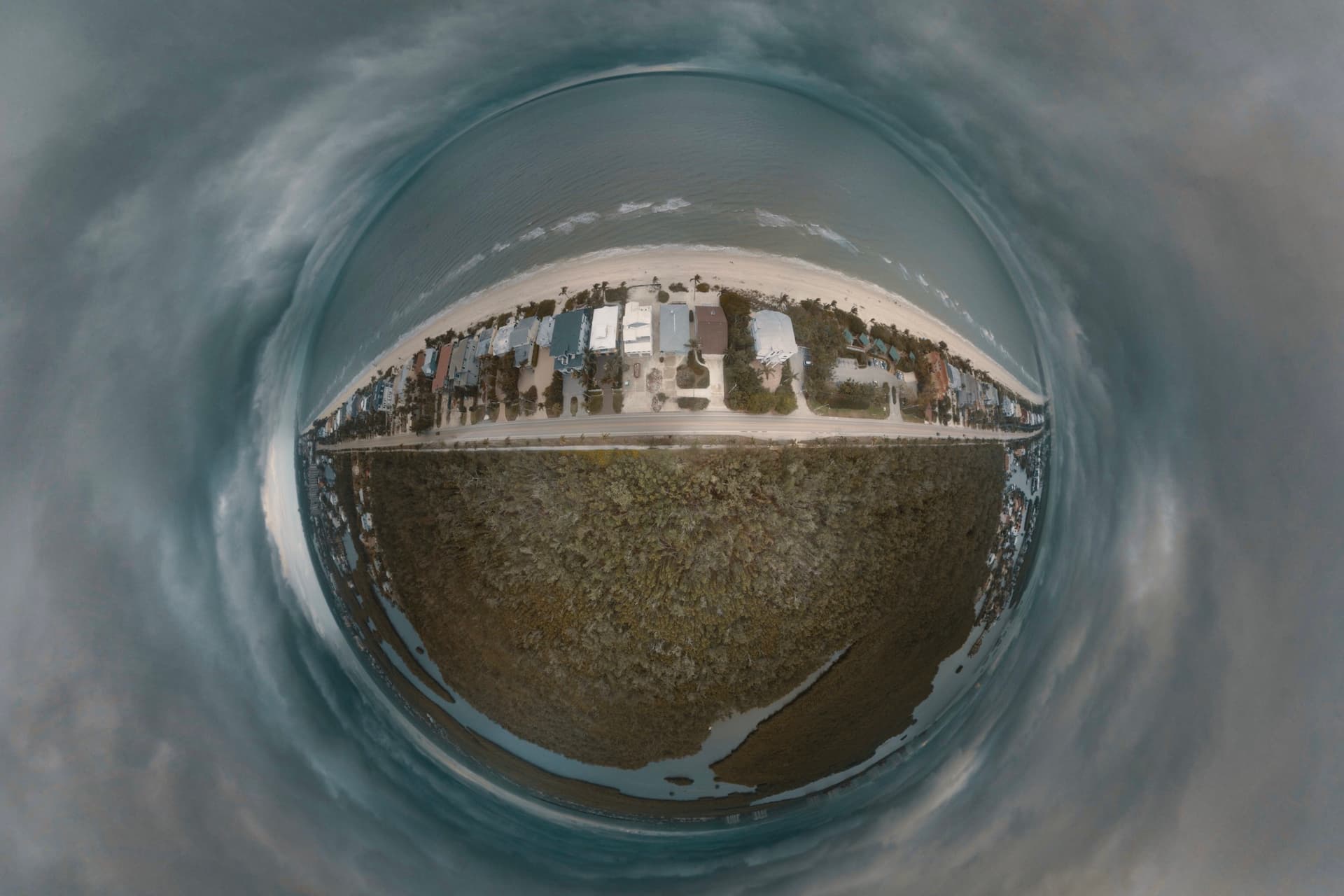 beach inside a bubble surrounded by clouds